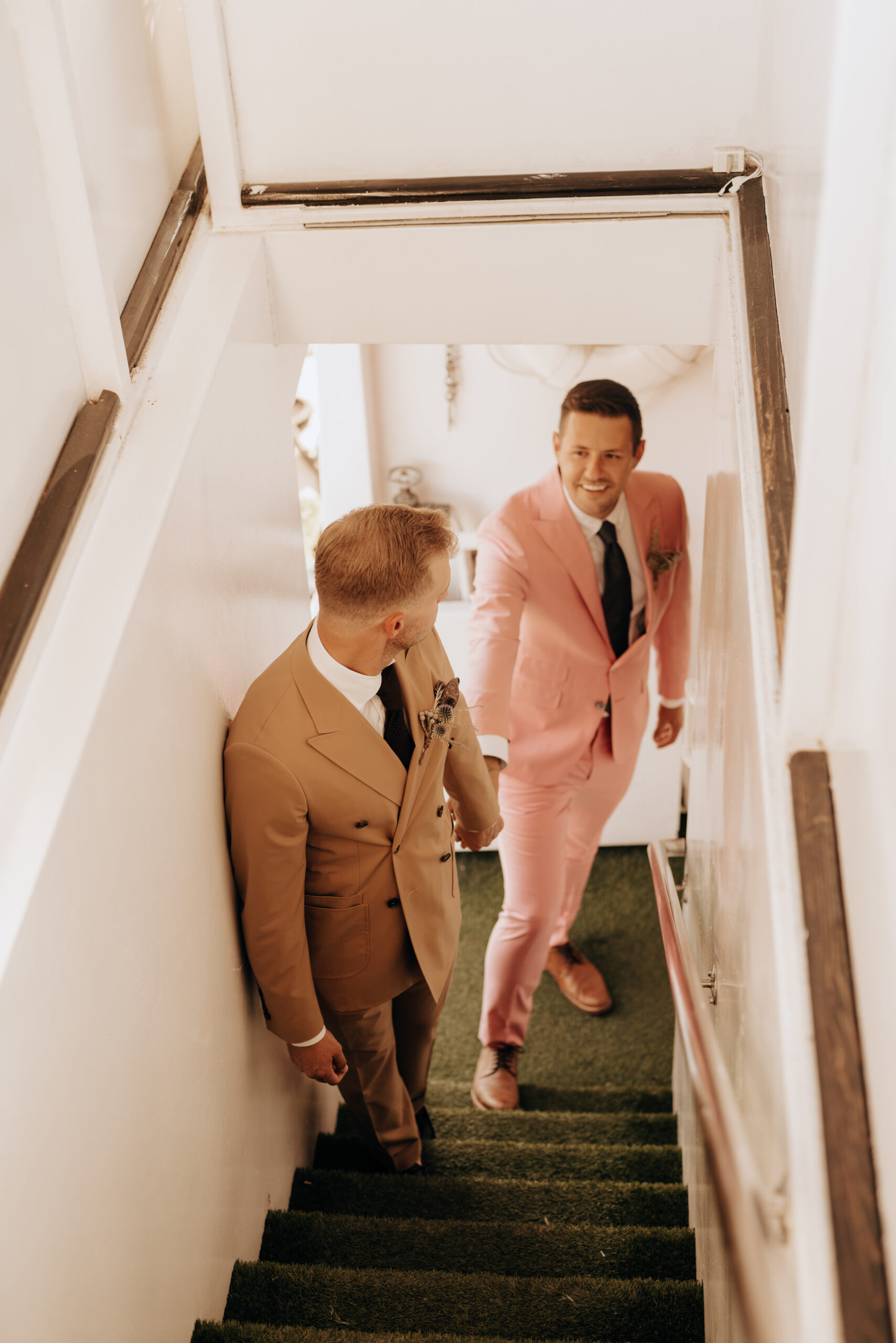 two grooms getting married on a boat