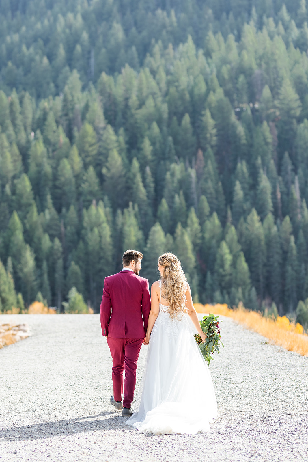 bride and groom on mountaintop